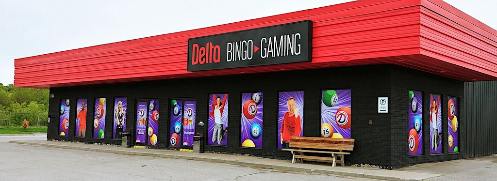 Exterior of Delta Bingo building in Peterborough. An attractive single story building with red flashing, black brick, and bingo advertisements in the windows.