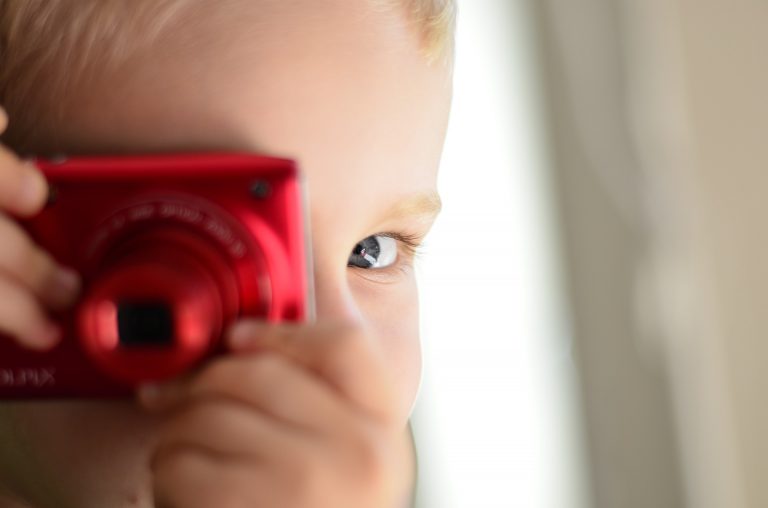 child with camera Therapeutic Family Care