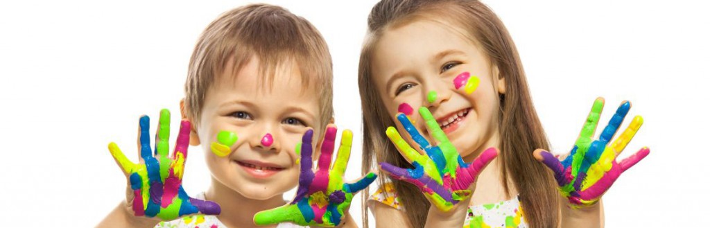 two children showing hands covered in fingerpaint